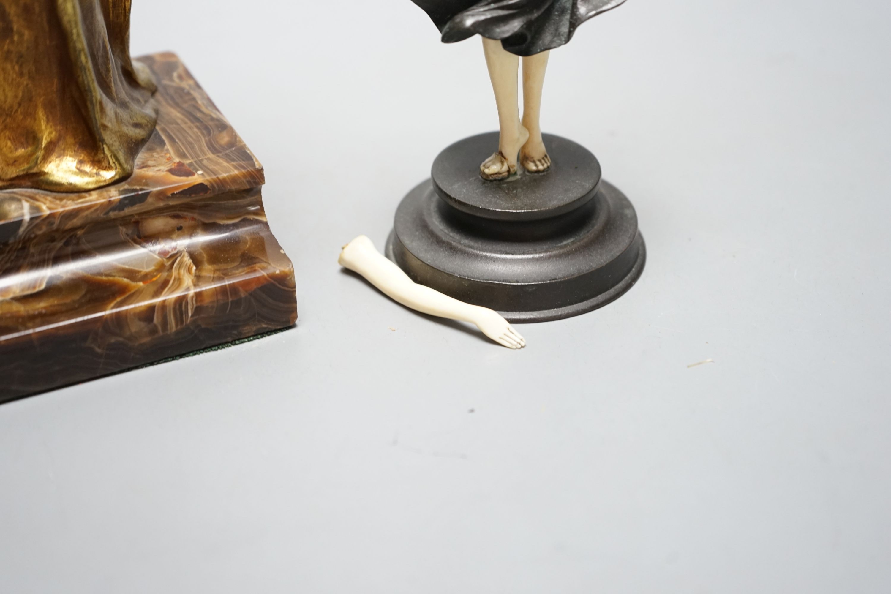 Georges Van Der Straeten, Belgian 1856-1928, An Art Deco bronze and ivory figure of a girl reading a book together with a smaller bronze and ivory figure, Tallest 31.5 cms high.